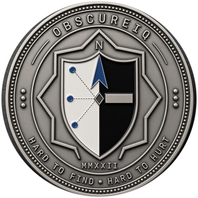 The ObscureIQ challenge coin: a compass needle and a redaction bar on a divided shield, ringed by the words Hard to find, hard to hurt.